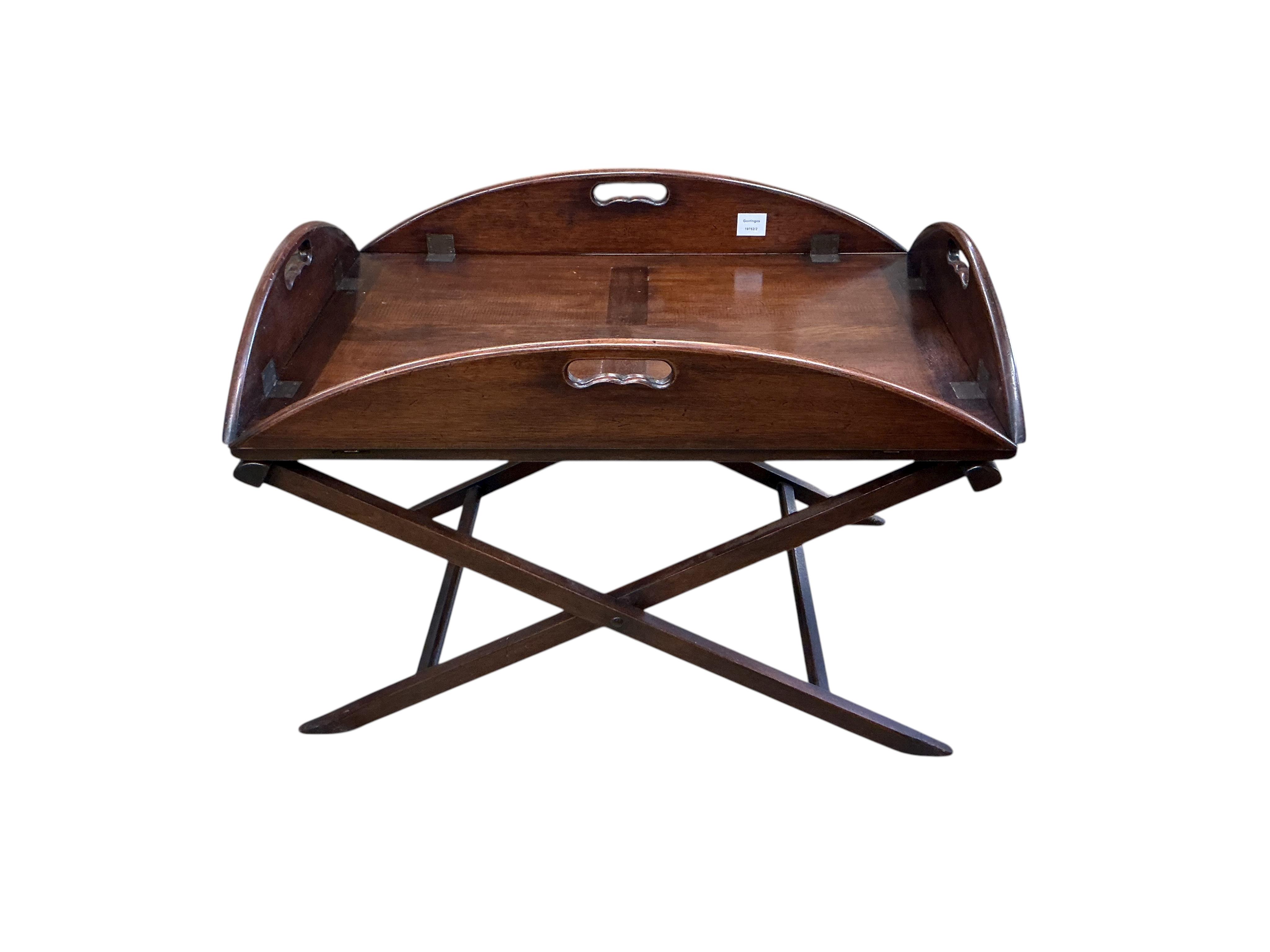A reproduction Victorian style mahogany butler's tray on folding stand, width 82cm, depth 57cm, height 58cm